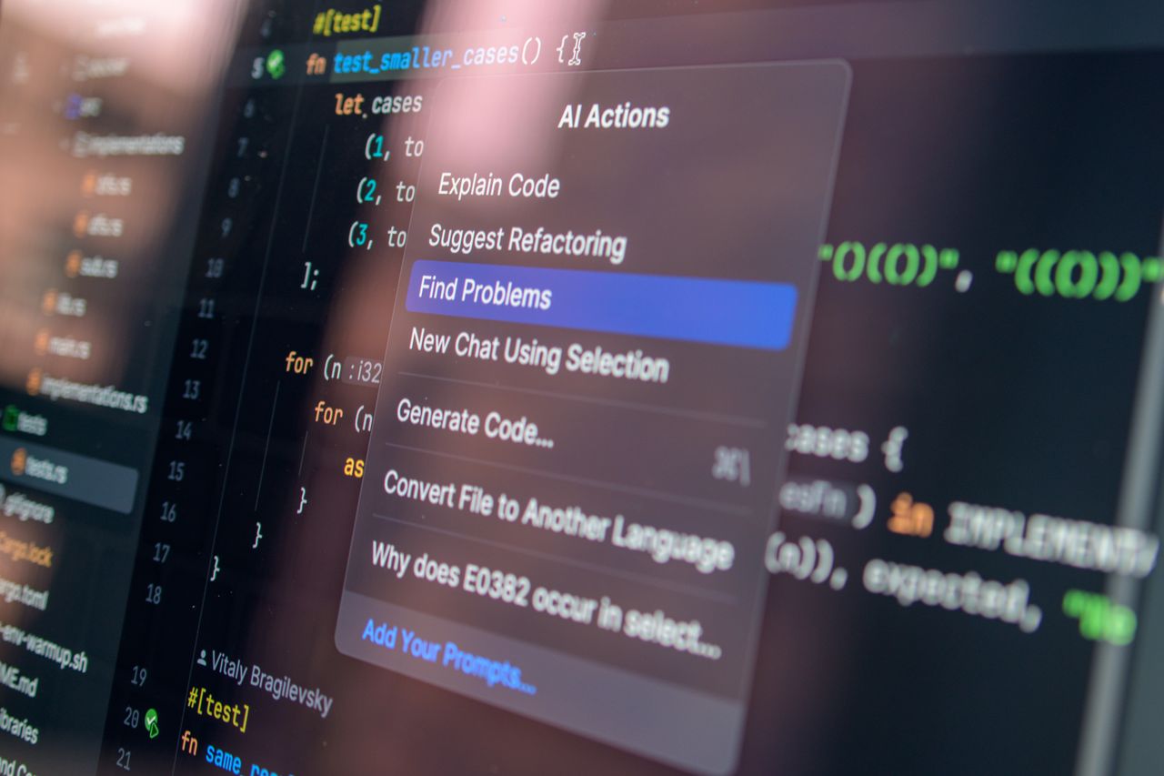 Home Close-up of AI-assisted coding with menu options for debugging and problem-solving.
